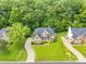 Aerial view of a beautiful brick home with a large front yard and mature trees, showcasing its desirable neighborhood setting at 1102 High Brook Dr, Waxhaw, NC 28173