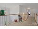 Hallway on the second floor of home, showing wood and white railings, and neutral walls at 1102 High Brook Dr, Waxhaw, NC 28173