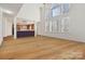 Bright living room with large windows, hardwood floors, and an open layout, perfect for entertaining at 1102 High Brook Dr, Waxhaw, NC 28173