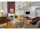 Inviting living room boasting a fireplace, hardwood floors, and an open layout to the upper level at 1102 High Brook Dr, Waxhaw, NC 28173