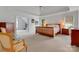 Spacious primary bedroom with tray ceiling, carpeted floors and a connecting sitting room at 1102 High Brook Dr, Waxhaw, NC 28173