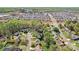 Overhead view of the neighborhood showcasing the tree-lined streets and neatly arranged houses at 11615 Hidden Grove Trl, Charlotte, NC 28215