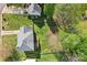 Aerial view of the home featuring its roof, wooden deck, backyard, wooden fence, and surrounding neighborhood at 11615 Hidden Grove Trl, Charlotte, NC 28215