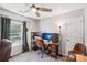 Bedroom with a large window, desk, and seating at 11615 Hidden Grove Trl, Charlotte, NC 28215