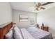 Bright bedroom featuring a bed and ceiling fan at 11615 Hidden Grove Trl, Charlotte, NC 28215