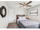 Cozy bedroom features a full-sized bed and a ceiling fan at 11615 Hidden Grove Trl, Charlotte, NC 28215