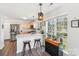 Bright kitchen featuring stainless steel appliances, granite countertops, and hardwood floors at 11615 Hidden Grove Trl, Charlotte, NC 28215