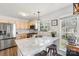 Modern kitchen featuring stainless steel appliances, granite counters, and ample natural light at 11615 Hidden Grove Trl, Charlotte, NC 28215