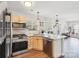 Bright kitchen with stainless steel appliances, granite countertops, and hardwood floors at 11615 Hidden Grove Trl, Charlotte, NC 28215