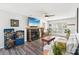 Comfortable living room featuring a fireplace, TV, and stylish decor at 11615 Hidden Grove Trl, Charlotte, NC 28215