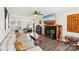 Inviting living room with a fireplace, neutral tones, and stylish decor at 11615 Hidden Grove Trl, Charlotte, NC 28215