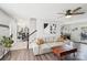 Spacious living room with hardwood floors and an open floor plan to the dining room at 11615 Hidden Grove Trl, Charlotte, NC 28215