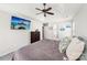 Spacious main bedroom featuring a ceiling fan, dresser, and an en-suite bathroom at 11615 Hidden Grove Trl, Charlotte, NC 28215