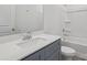 A bathroom featuring a single vanity sink and a shower-tub combination with tiled walls at 1234 Morehead Dr, Salisbury, NC 28144