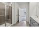Modern bathroom featuring a tiled shower with a glass door and a sleek vanity with gray cabinetry at 1234 Morehead Dr, Salisbury, NC 28144