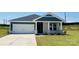 Charming single-story home featuring stone accents, a two-car garage, and a well-manicured lawn at 1234 Morehead Dr, Salisbury, NC 28144