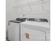 Laundry room featuring Whirlpool washer and dryer, as well as wire shelving at 1234 Morehead Dr, Salisbury, NC 28144