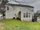Backyard featuring a well-maintained lawn, a wooden deck, a white fence, and the exterior of the home at 1240 Periwinkle Dr, Waxhaw, NC 28173