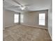 Spacious bedroom with carpet, neutral paint, ceiling fan, and lots of windows for natural light at 1240 Periwinkle Dr, Waxhaw, NC 28173