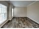 Bedroom with laminate floors, large windows, and neutral paint at 1240 Periwinkle Dr, Waxhaw, NC 28173