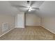 Bonus room featuring neutral walls, plush carpeting, and a ceiling fan for comfort at 1240 Periwinkle Dr, Waxhaw, NC 28173