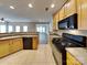 Traditional kitchen features tile floors and appliances plus an open floor plan at 1240 Periwinkle Dr, Waxhaw, NC 28173