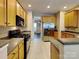 Well-equipped kitchen with stainless steel appliances and a view of the dining room at 1240 Periwinkle Dr, Waxhaw, NC 28173