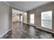 Bright living room boasts laminate floors, large windows, and neutral paint at 1240 Periwinkle Dr, Waxhaw, NC 28173