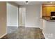 View of the living room and kitchen, laminate floors, and neutral paint at 1240 Periwinkle Dr, Waxhaw, NC 28173
