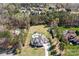 Aerial view of a home with a large lot, fenced backyard, pool, and surrounded by mature trees at 127 Castle Dr, Mooresville, NC 28117