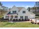 Charming two-story home with a well-manicured lawn and patriotic flags at 127 Castle Dr, Mooresville, NC 28117