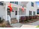 Close-up of front entrance to home with stone steps, patio, and flags at 127 Castle Dr, Mooresville, NC 28117