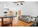 Open-concept living room featuring hardwood floors, neutral paint, and access to the kitchen at 127 Castle Dr, Mooresville, NC 28117