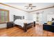 Serene main bedroom featuring wood trim accents, hardwood floors, and ample natural light at 127 Castle Dr, Mooresville, NC 28117