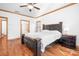 Relaxing main bedroom with a large bed, wood trim, and connecting bath access at 127 Castle Dr, Mooresville, NC 28117