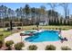 Pool area featuring hot tub, fire pit, and shed at 127 Castle Dr, Mooresville, NC 28117