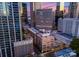 Scenic aerial view of the building, with the city skyline creating a captivating contrast at dusk at 127 N Tryon St # 615, Charlotte, NC 28202