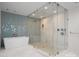 Bright bathroom featuring a walk-in shower, a soaking tub, and modern finishes at 127 N Tryon St # 615, Charlotte, NC 28202