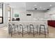Modern kitchen featuring a spacious island with bar seating and stainless steel appliances at 127 N Tryon St # 615, Charlotte, NC 28202