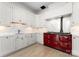 Bright kitchen featuring custom cabinetry, modern countertops, and a red range cooker at 127 N Tryon St # 615, Charlotte, NC 28202