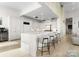 Bright, open kitchen with a large island, white cabinetry, and modern countertops at 127 N Tryon St # 615, Charlotte, NC 28202