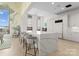 Spacious kitchen with a large island, bar seating, and floor-to-ceiling windows at 127 N Tryon St # 615, Charlotte, NC 28202