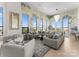 Bright living room featuring tall windows, comfortable seating, and decorative accents, great for entertaining at 127 N Tryon St # 615, Charlotte, NC 28202
