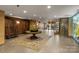 A welcoming lobby featuring a round table, tile floors and a luggage cart at 127 N Tryon St # 615, Charlotte, NC 28202