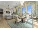 Open concept living area combining dining and living spaces, featuring large windows and stylish decor at 127 N Tryon St # 615, Charlotte, NC 28202