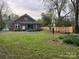 Spacious backyard featuring a wooden fence and mature trees at 146 Saluda St, Chester, SC 29706