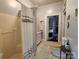 Bathroom featuring a shower, a vanity, a toilet, tile floors, and an adjoining bedroom view at 146 Saluda St, Chester, SC 29706
