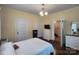 Spacious bedroom with hardwood floors, neutral paint, abundant natural light, and classic furniture at 146 Saluda St, Chester, SC 29706