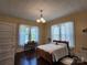 Cozy bedroom featuring hardwood floors, ample natural light, and a comfortable bed at 146 Saluda St, Chester, SC 29706
