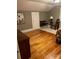 Cozy bedroom with hardwood floors, neutral walls, decorative trim, a wooden bed and furniture at 146 Saluda St, Chester, SC 29706